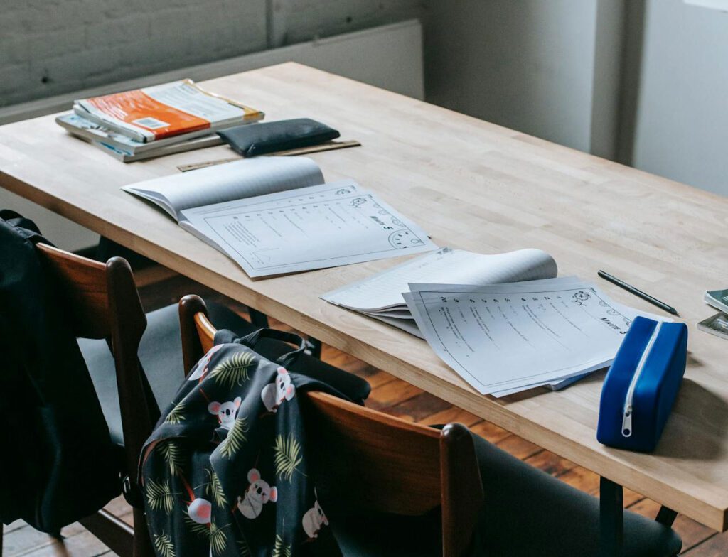 School desk with papers on it but no students