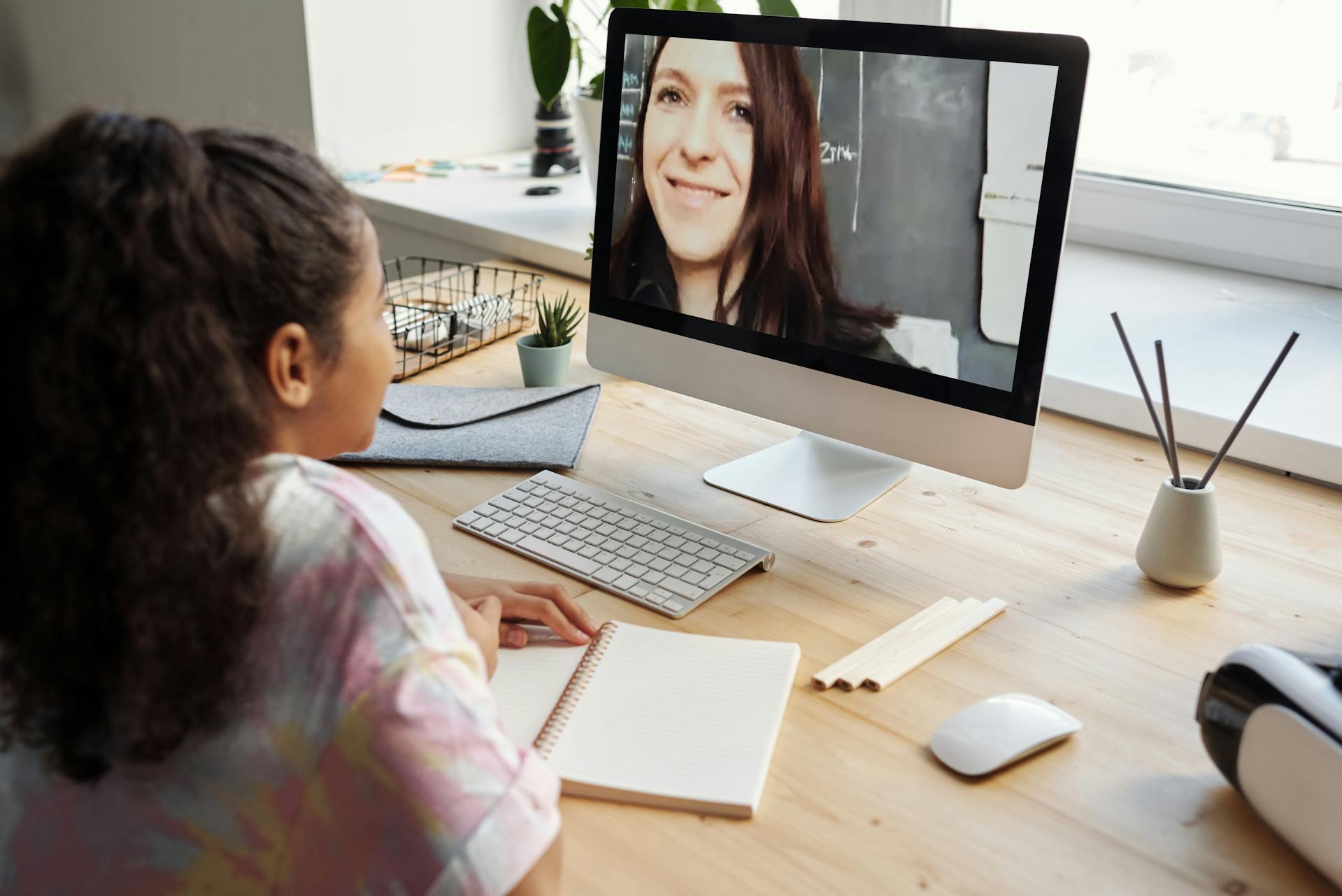 A speech therapist delivers a telehealth care session to a student as demand for speech therapists rises.