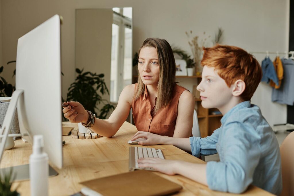 A telepractice for speech therapy session with an adult and young student.